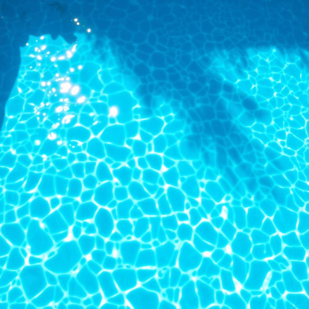 Crystal clear sparkling pool water close-up